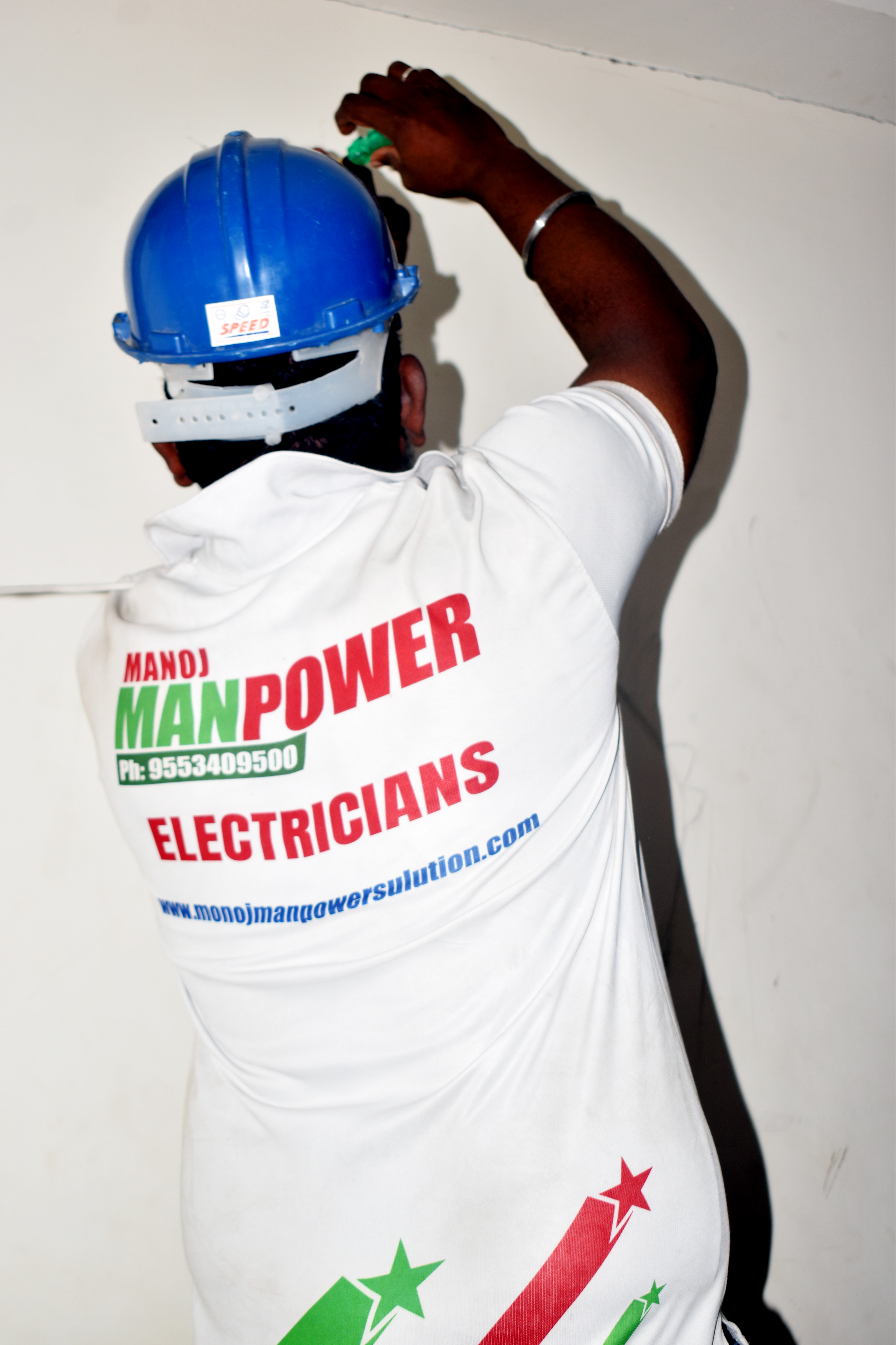 Professional painter working on wall